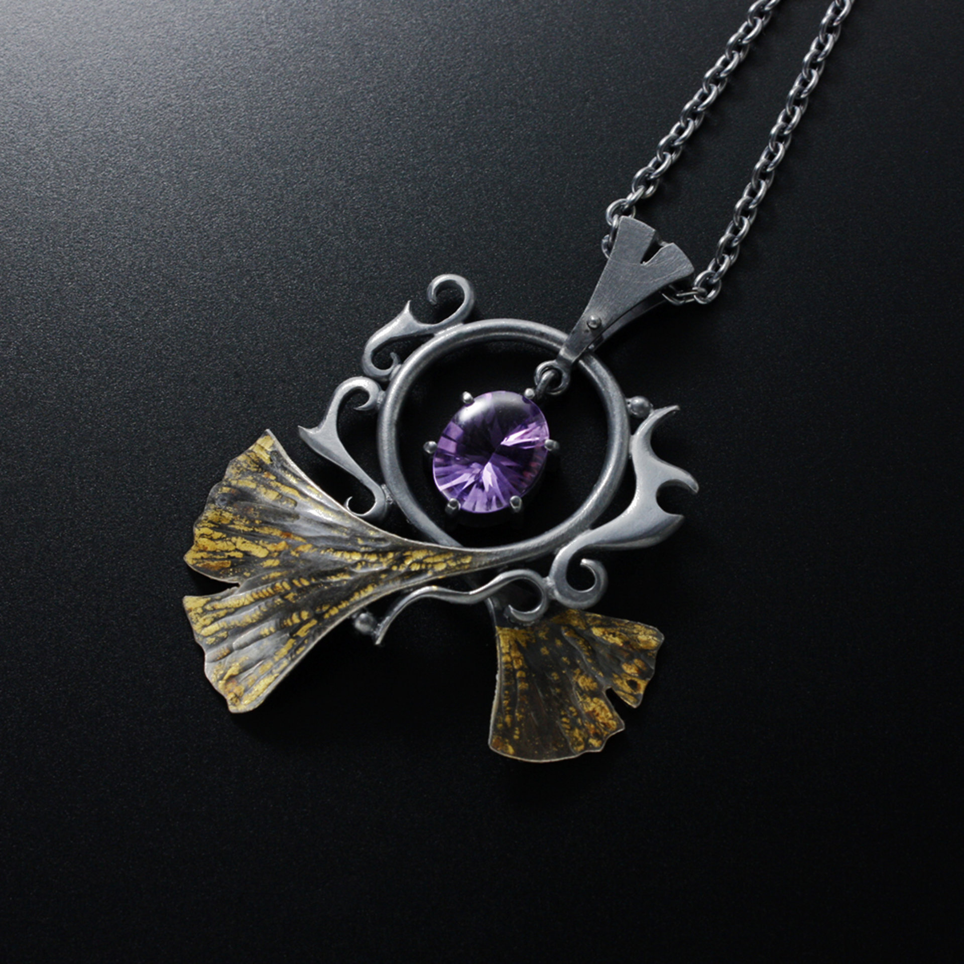 Oxidized silver ginkgo pendant necklace with amethyst and worn out gold leaf