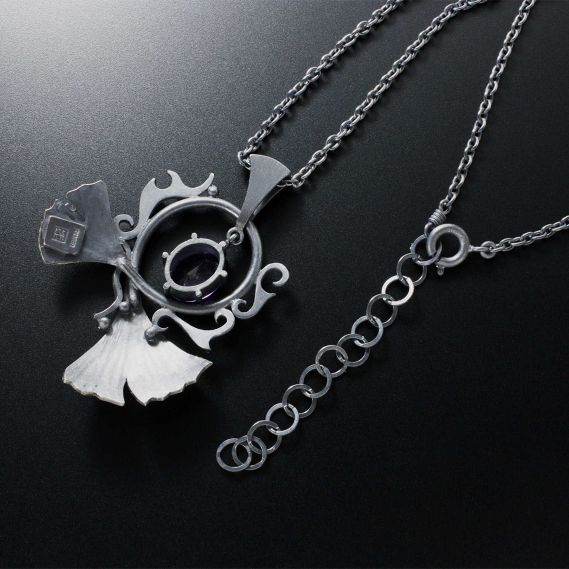 Oxidized silver ginkgo pendant necklace with amethyst and worn out gold leaf
