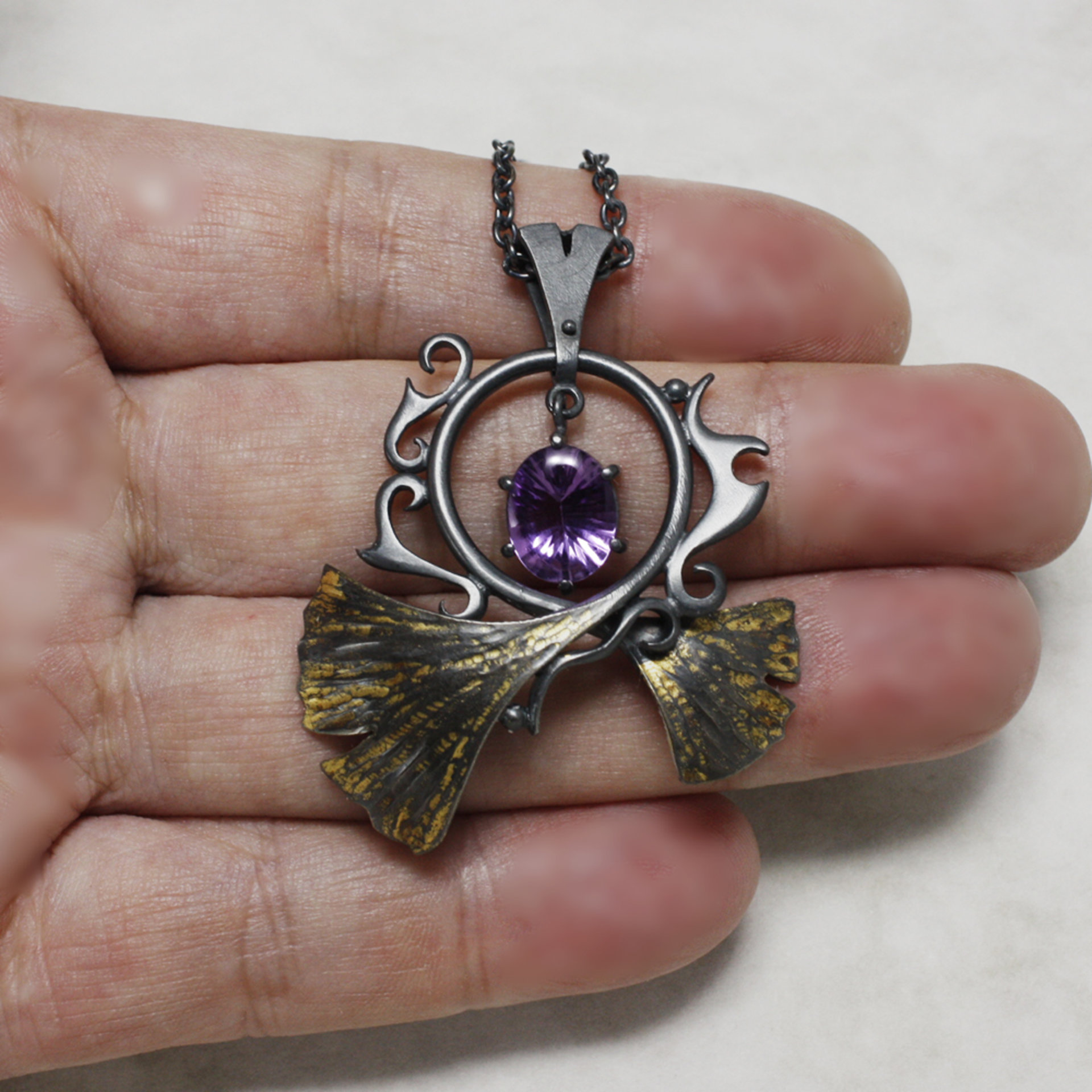 Oxidized silver ginkgo pendant necklace with amethyst and worn out gold leaf