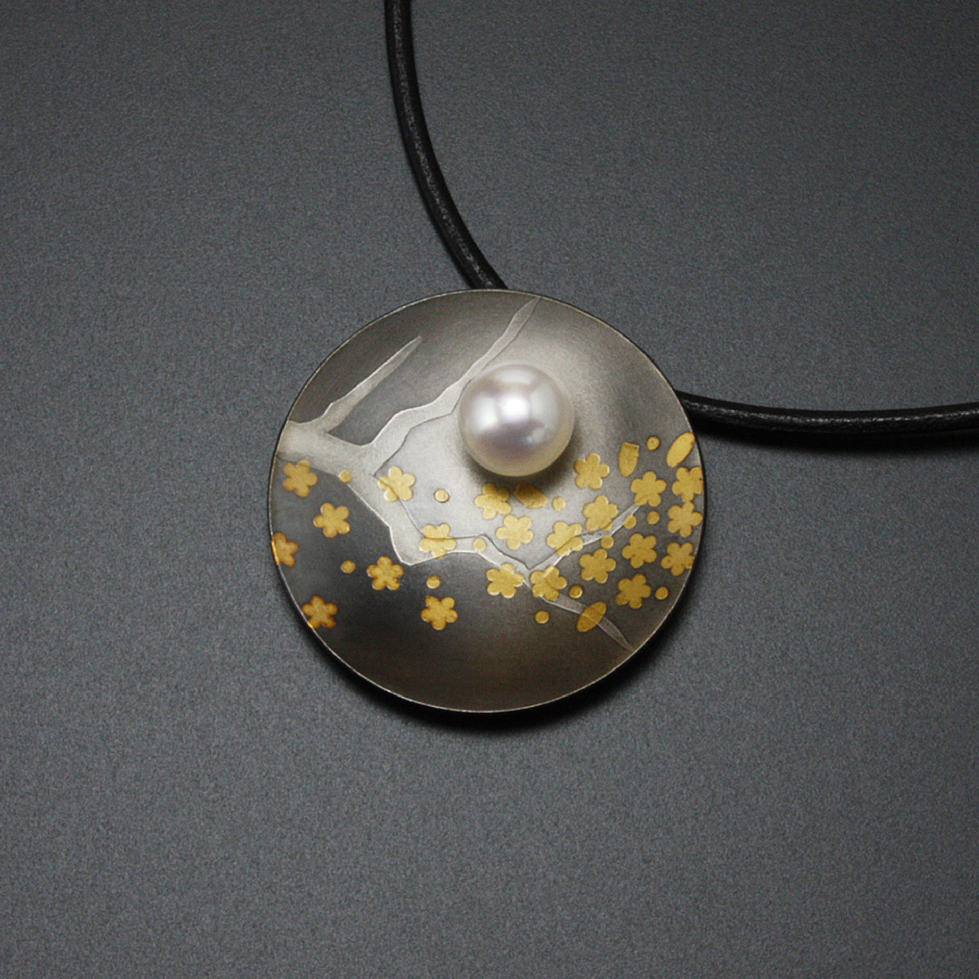 Round Keum Boo oxidized silver pendant necklace of falling plum blossoms with Ak