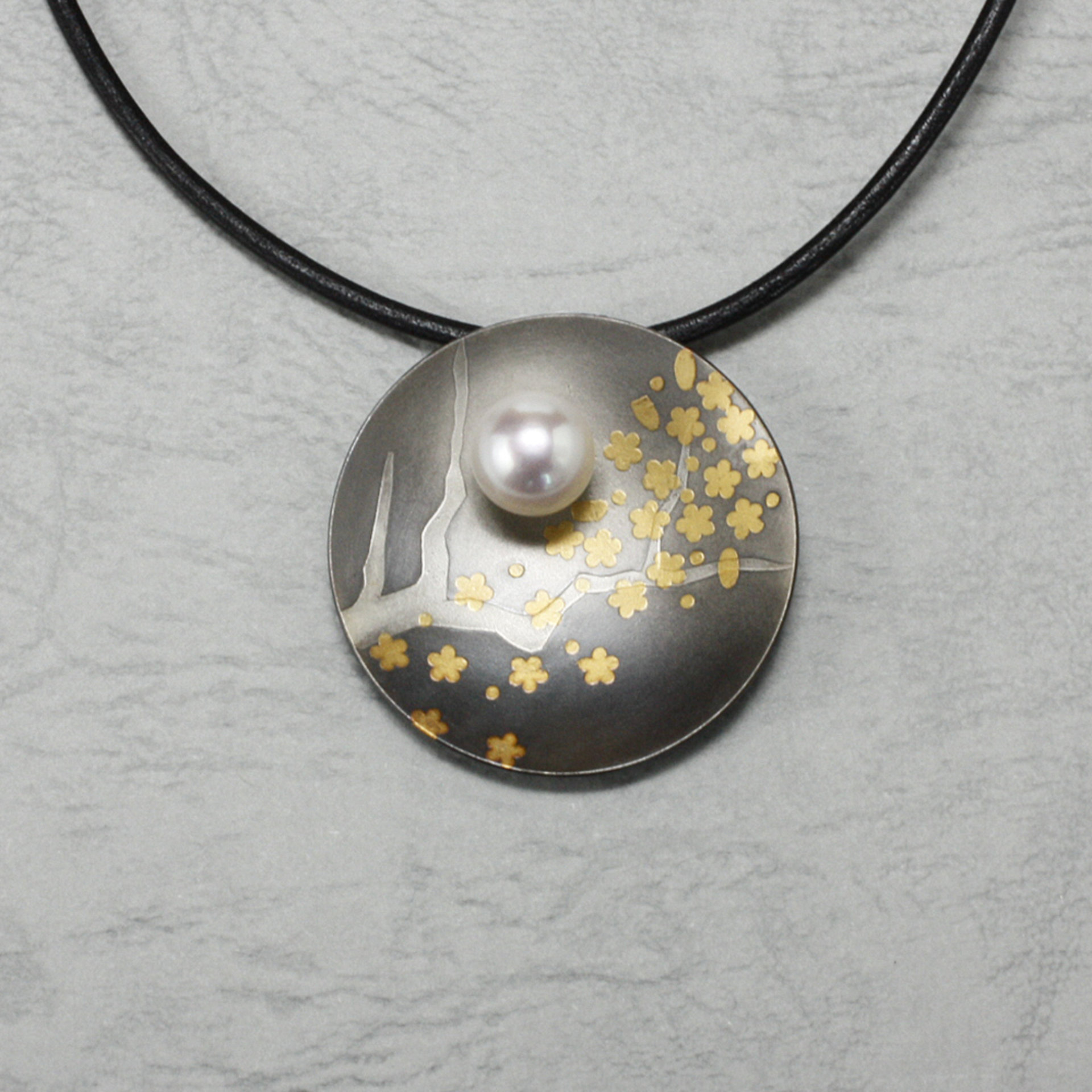 Round Keum Boo oxidized silver pendant necklace of falling plum blossoms with Ak