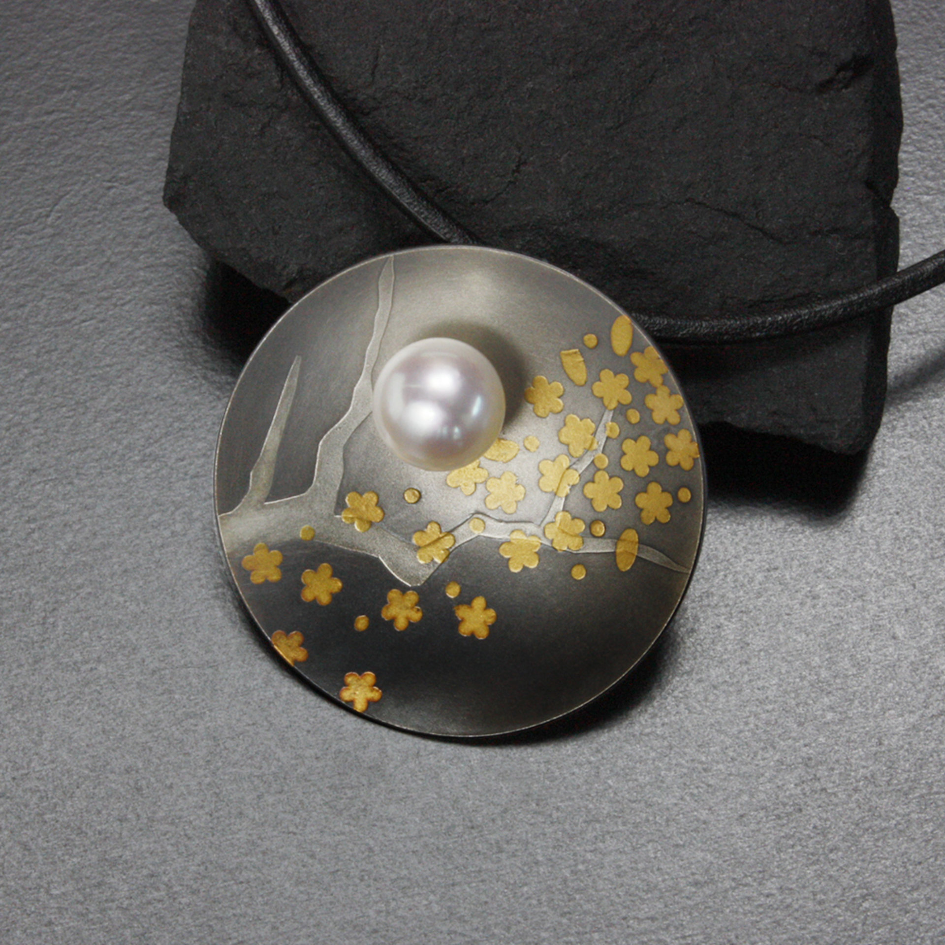 Round Keum Boo oxidized silver pendant necklace of falling plum blossoms with Ak