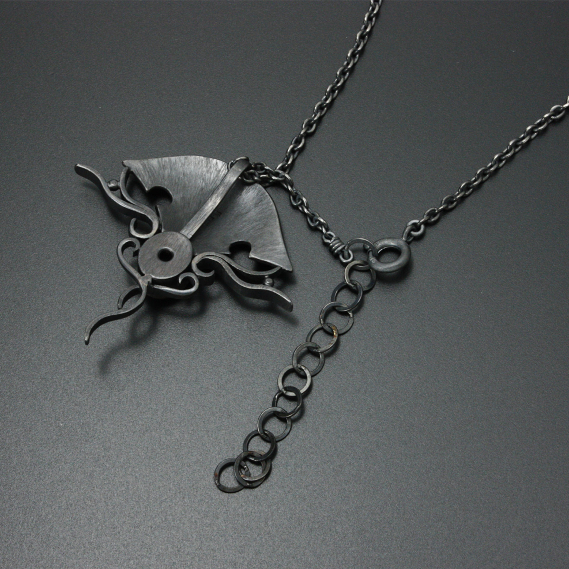 Black star sapphire steampunk silver and gold necklace