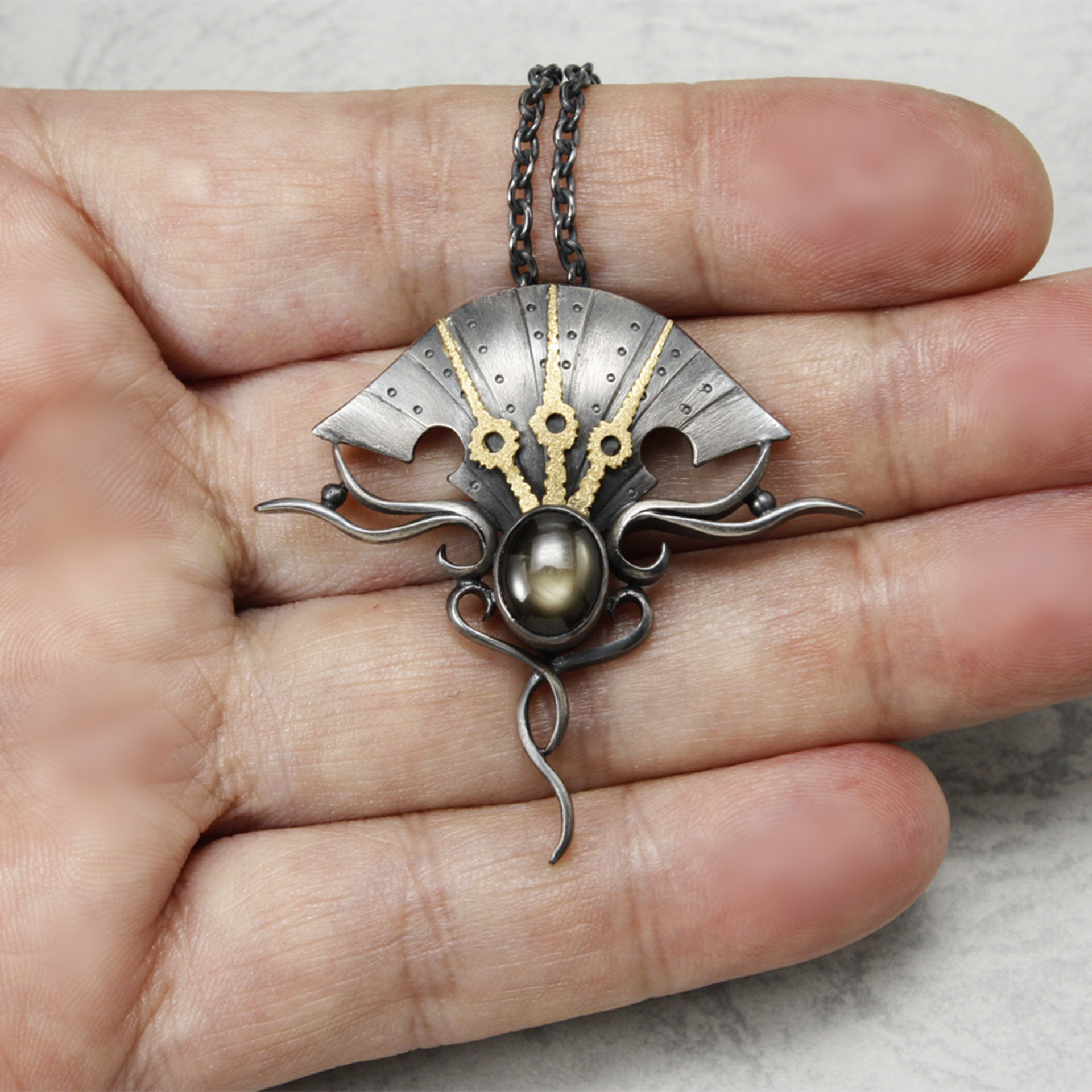 Black star sapphire steampunk silver and gold necklace
