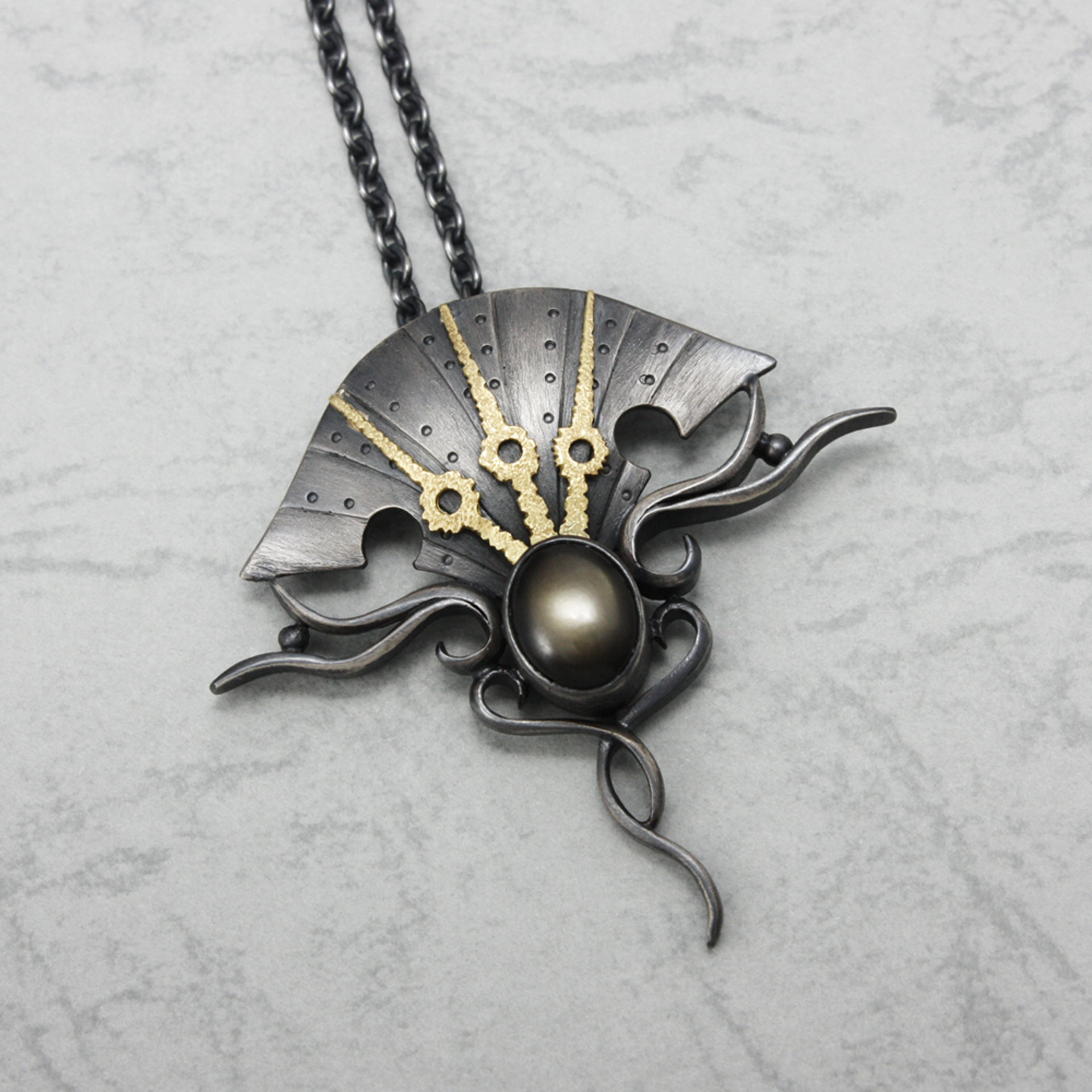 Black star sapphire steampunk silver and gold necklace