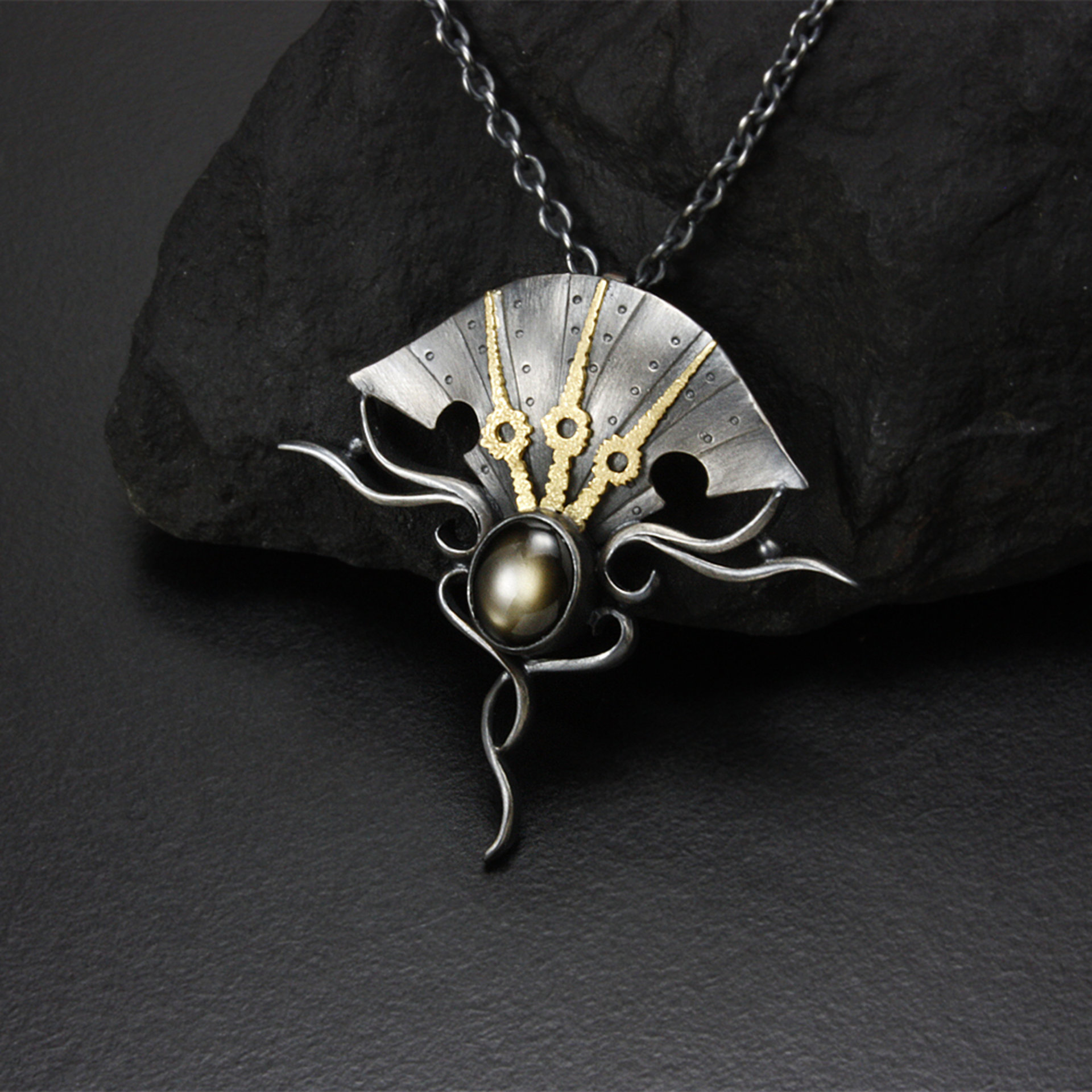 Black star sapphire steampunk silver and gold necklace