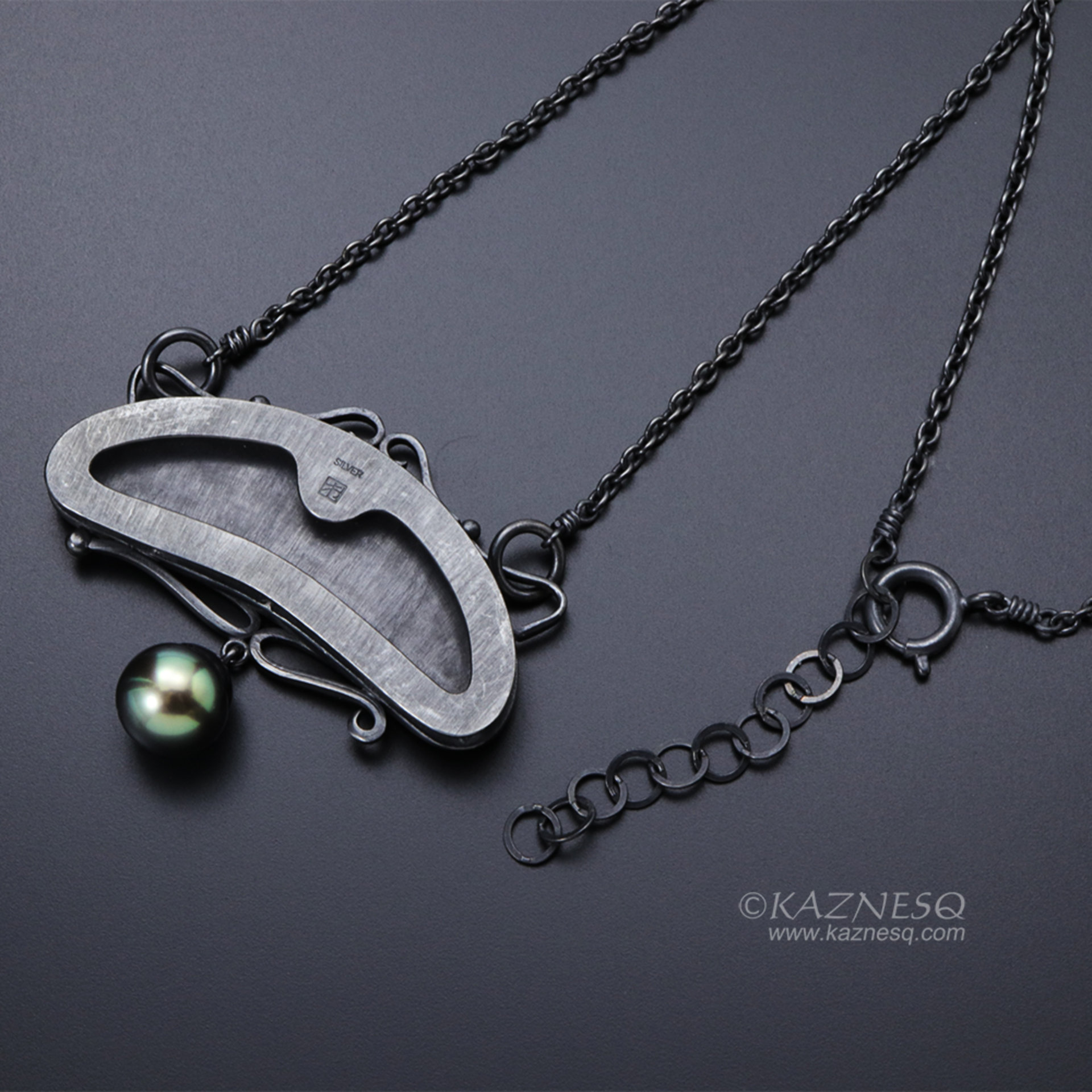 Art Nouveau style pine tree motif necklace with a black pearl