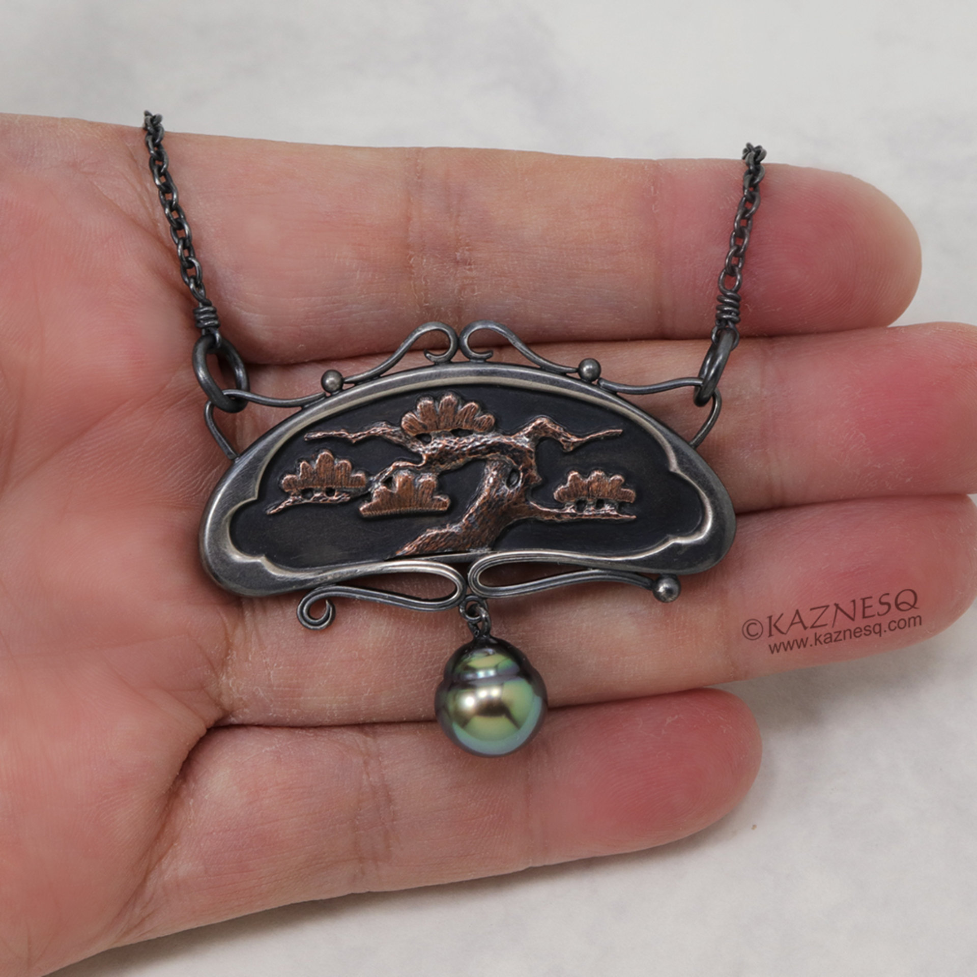 Art Nouveau style pine tree motif necklace with a black pearl