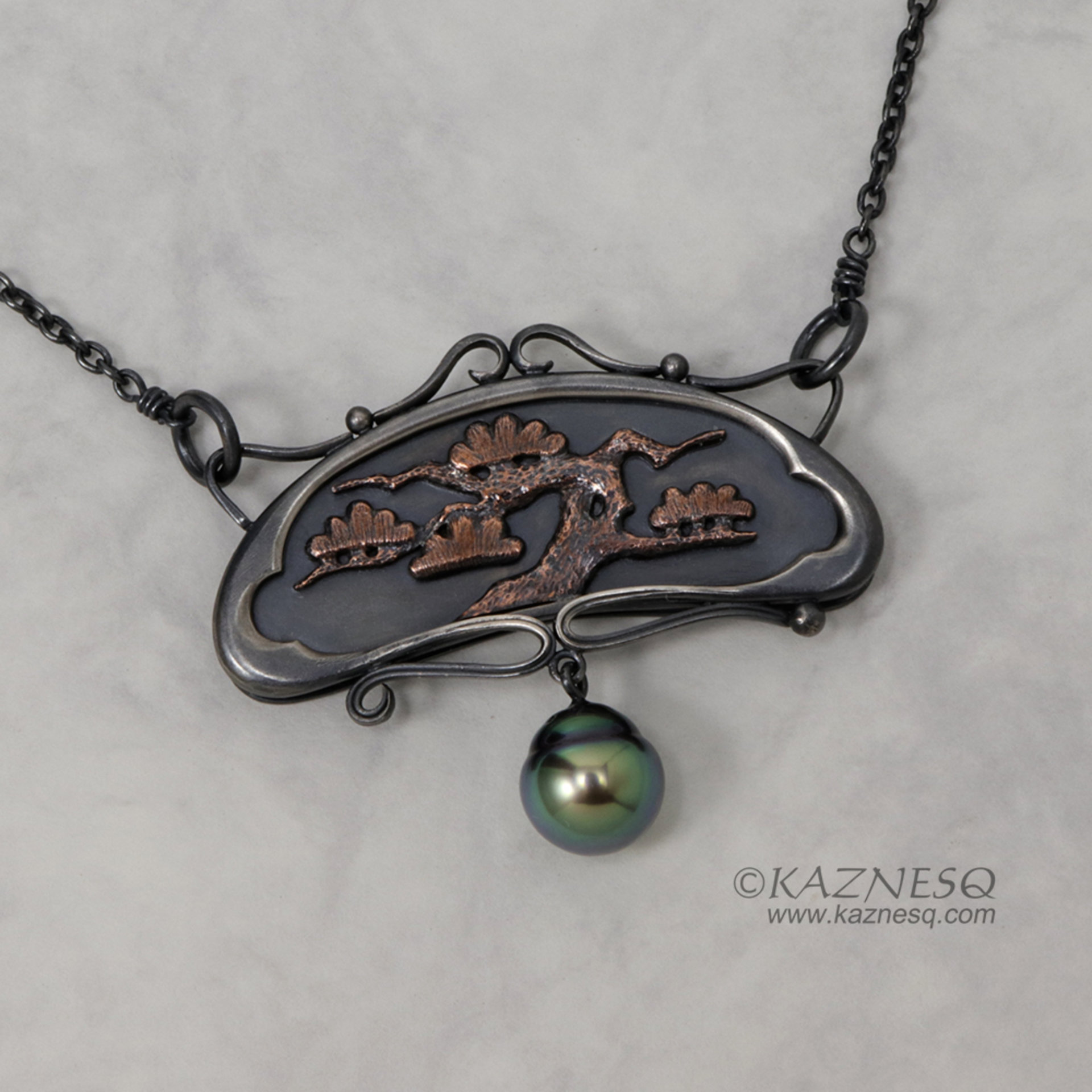 Art Nouveau style pine tree motif necklace with a black pearl