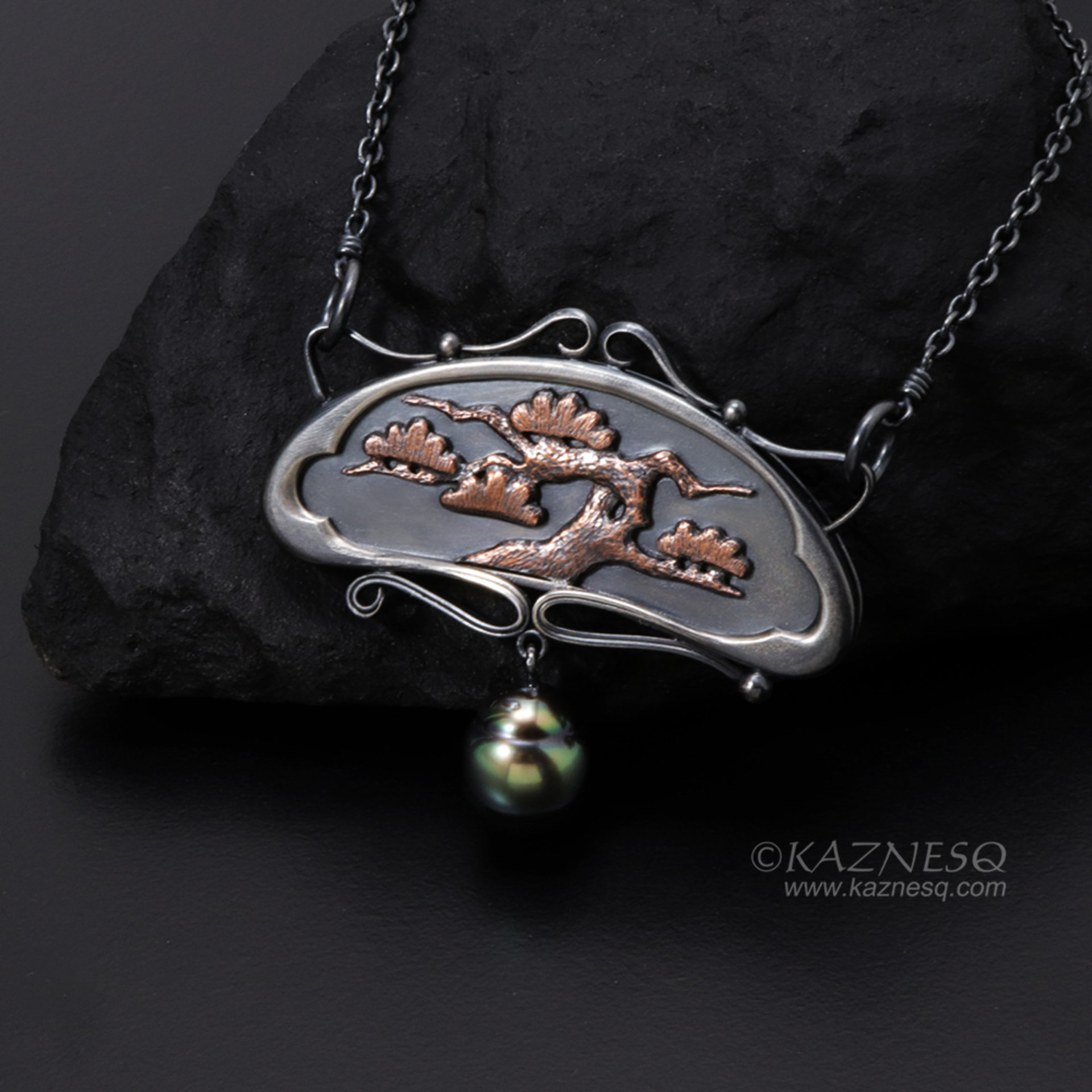 Art Nouveau style pine tree motif necklace with a black pearl