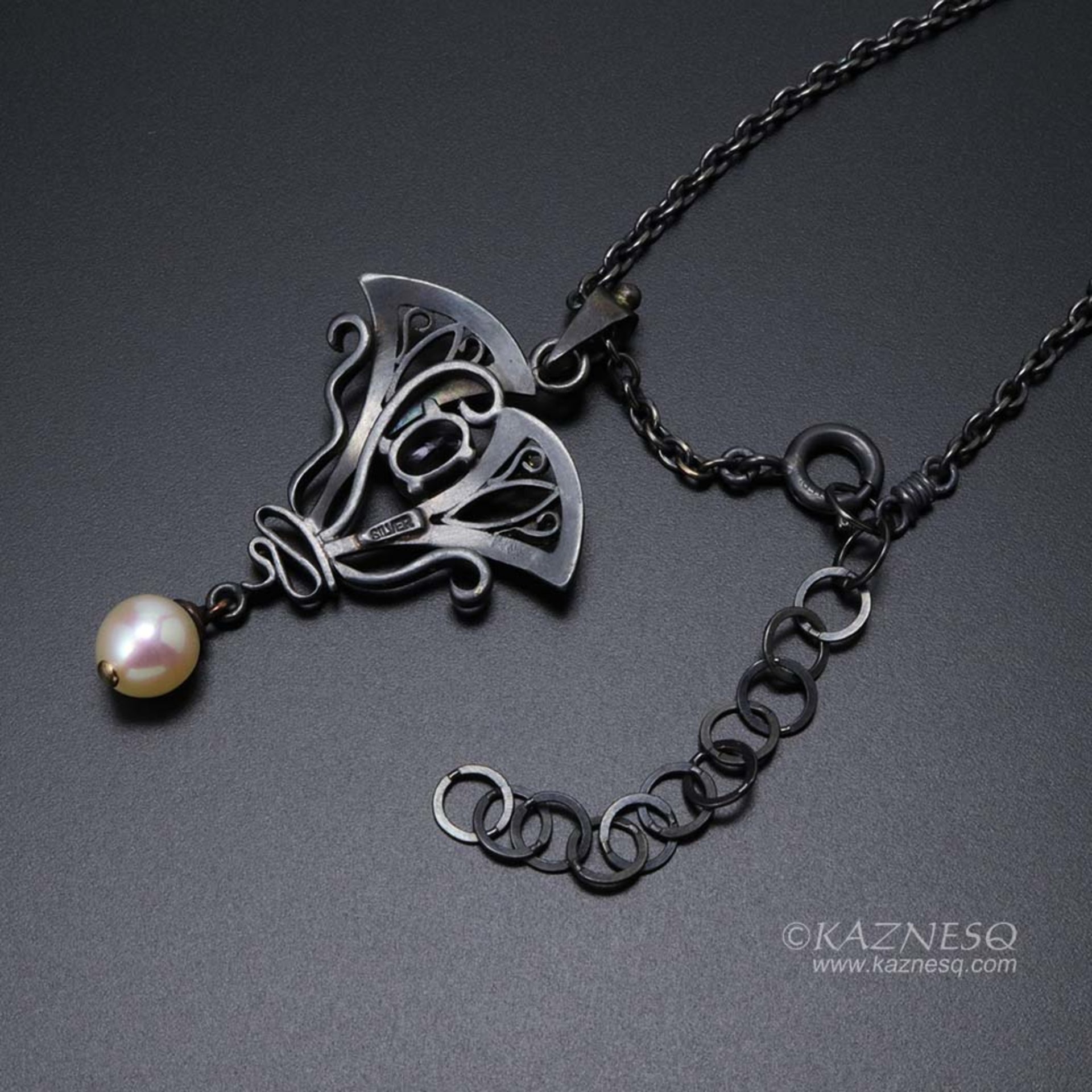 Lavender spinel Art Nouveau style oxidized silver pendant with a freshwater pear