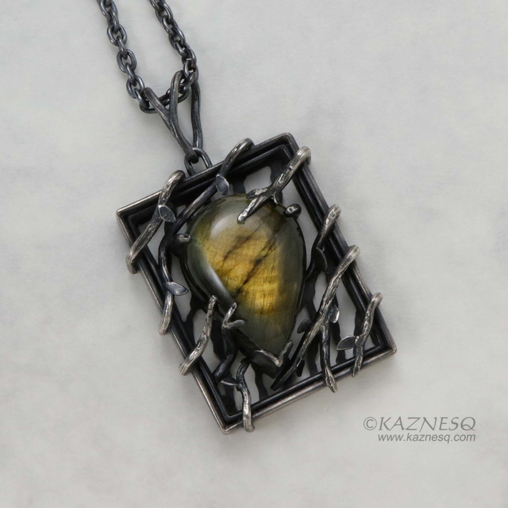 (C) KAZNESQ: Yellow labradorite trapped in a bush goth oxidized silver pendant