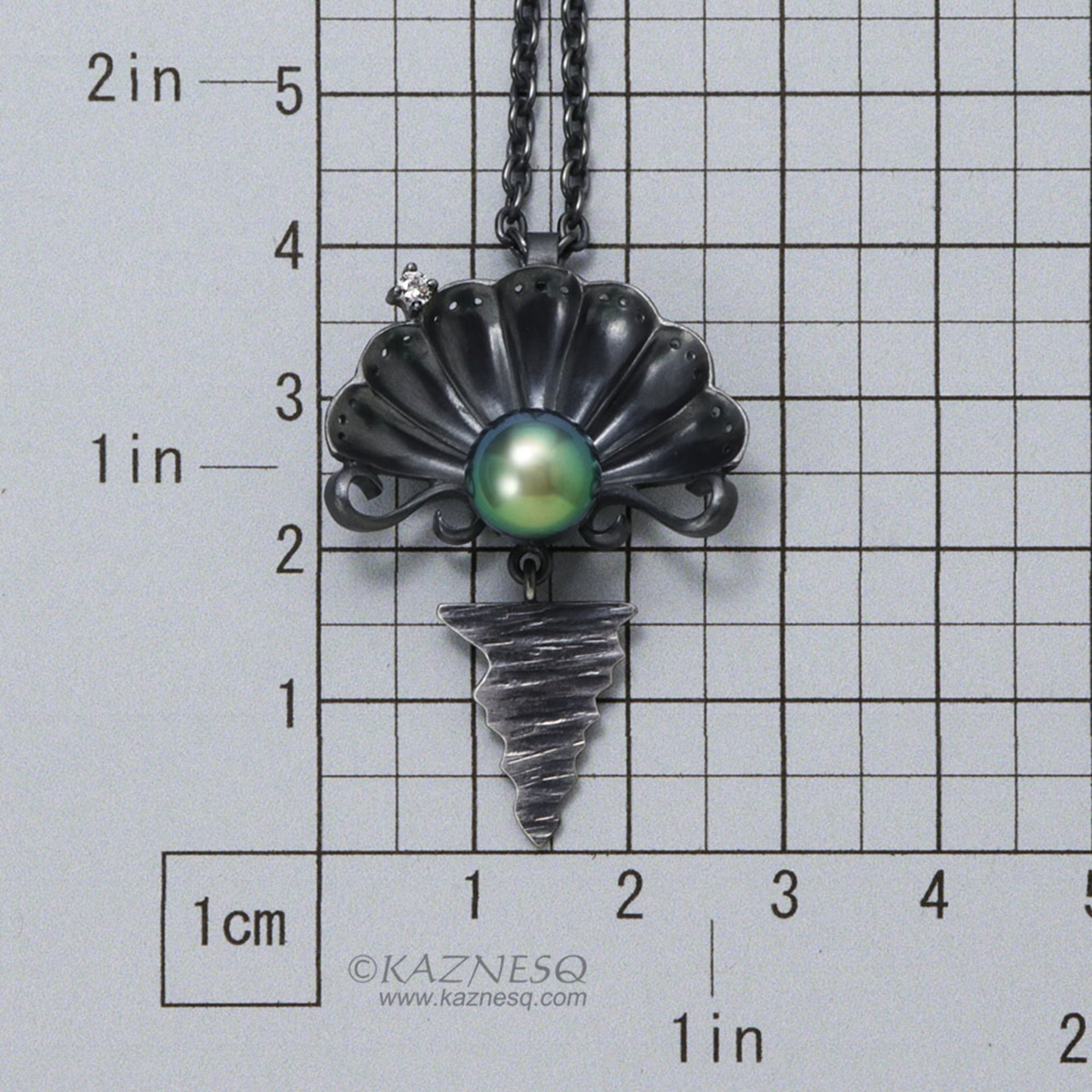 The moon on the ocean and Venus pendant, Black south sea pearl and a diamond oxi