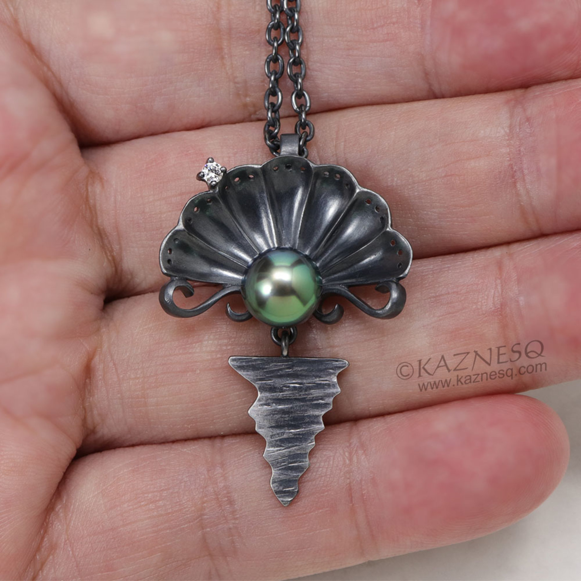 The moon on the ocean and Venus pendant, Black south sea pearl and a diamond oxi