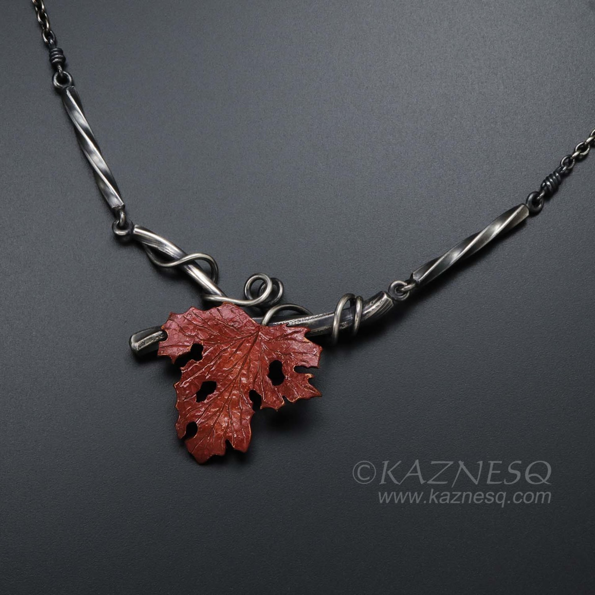 Withered copper grape leaf with Japanese patina and oxidized silver necklace .