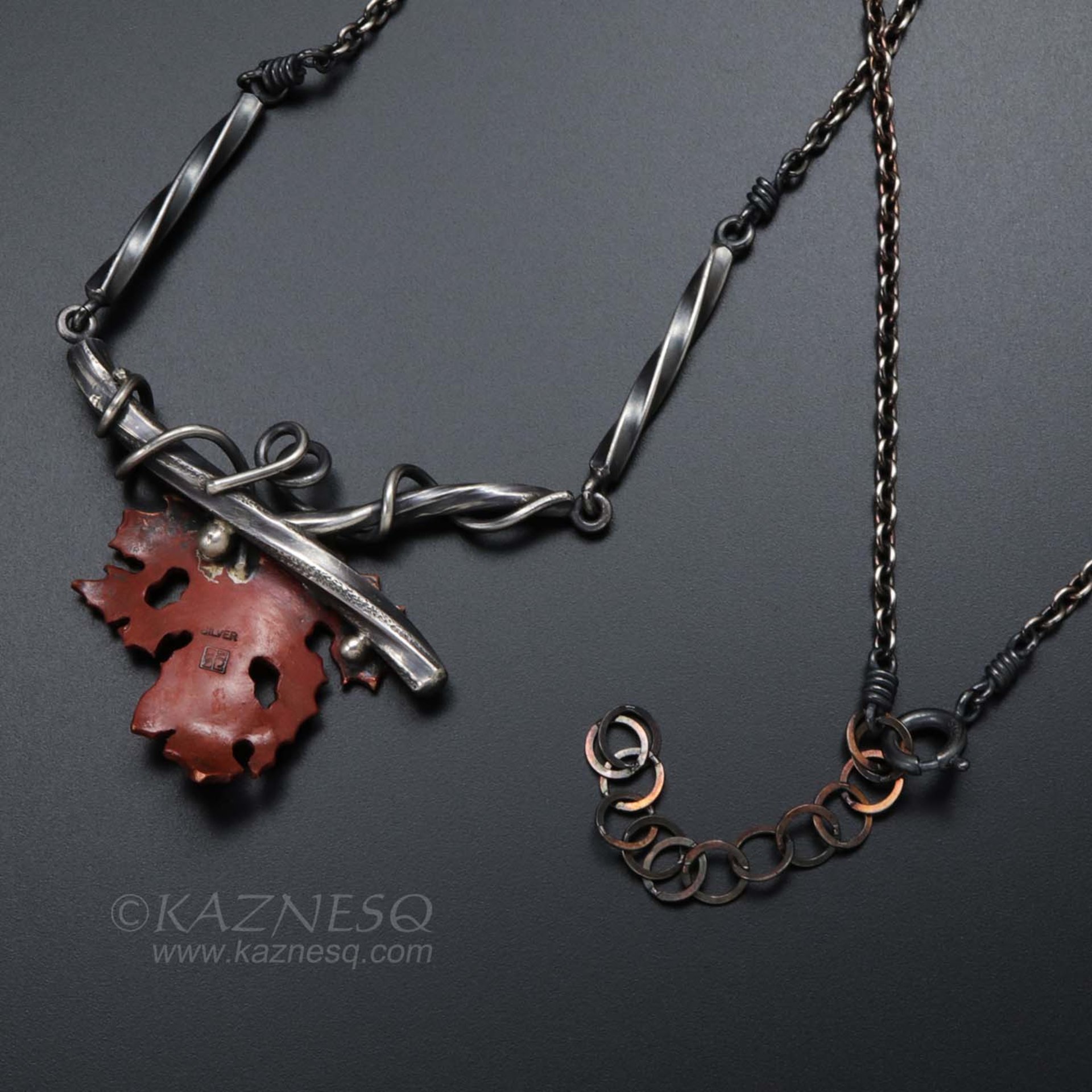 Withered copper grape leaf with Japanese patina and oxidized silver necklace .