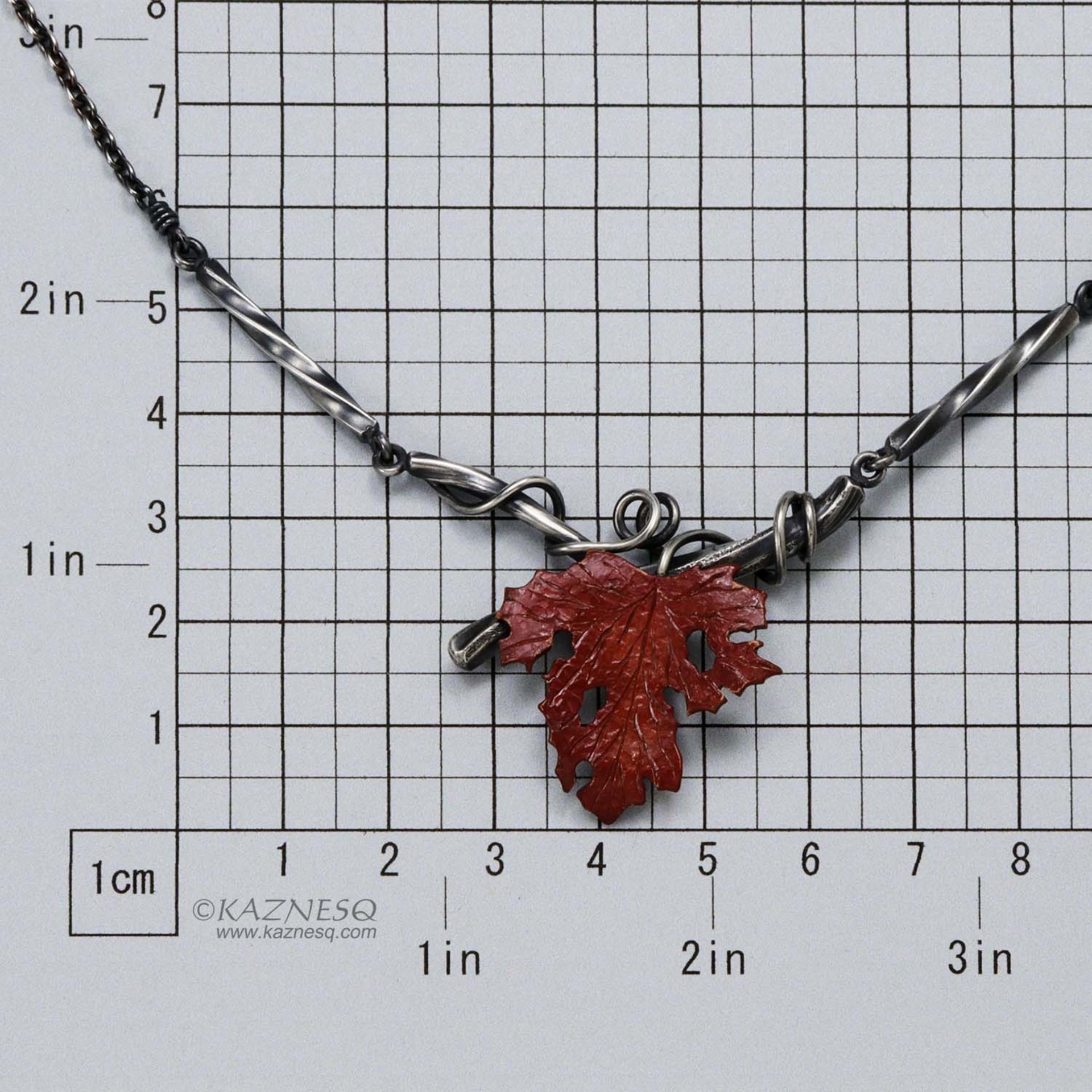Withered copper grape leaf with Japanese patina and oxidized silver necklace .