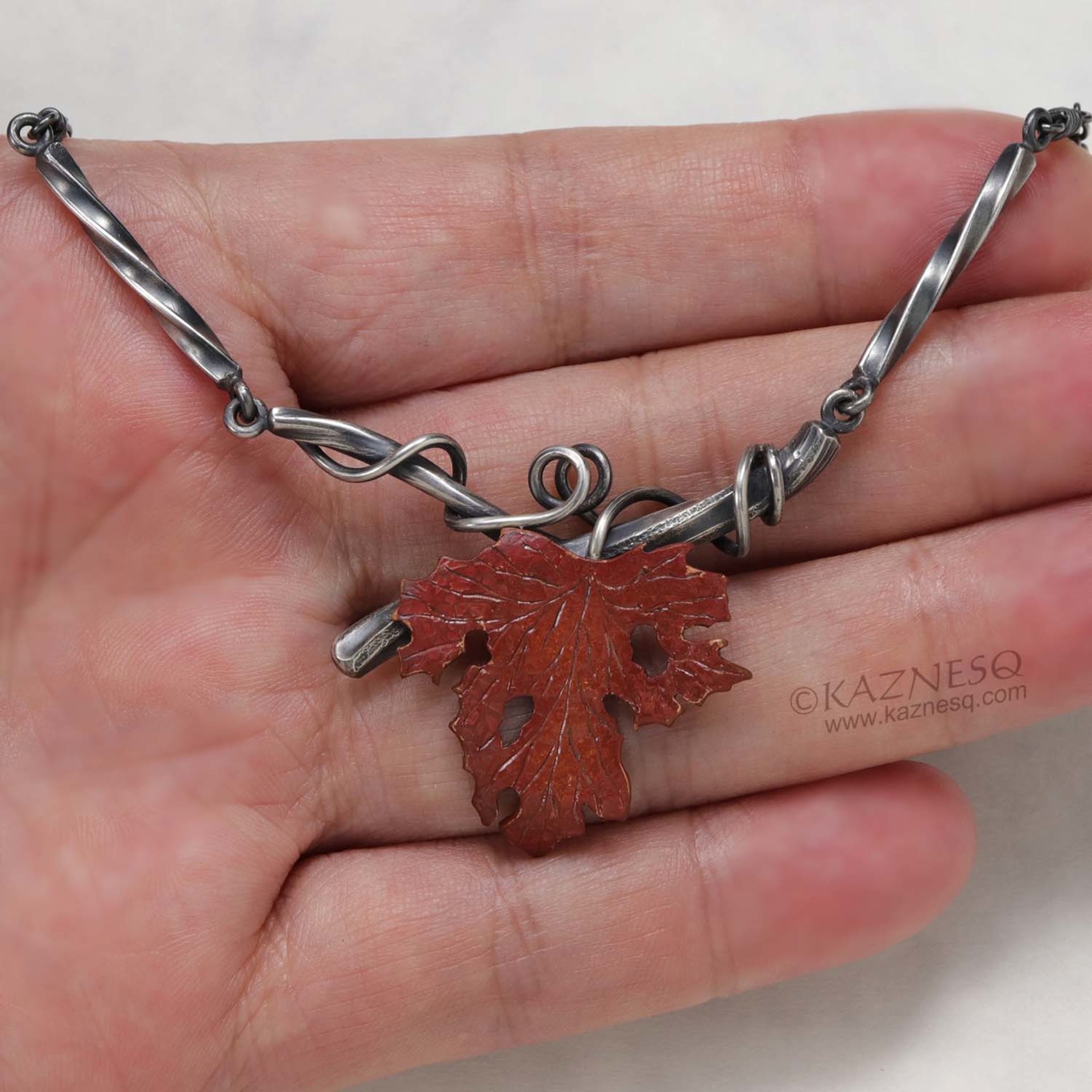 Withered copper grape leaf with Japanese patina and oxidized silver necklace .