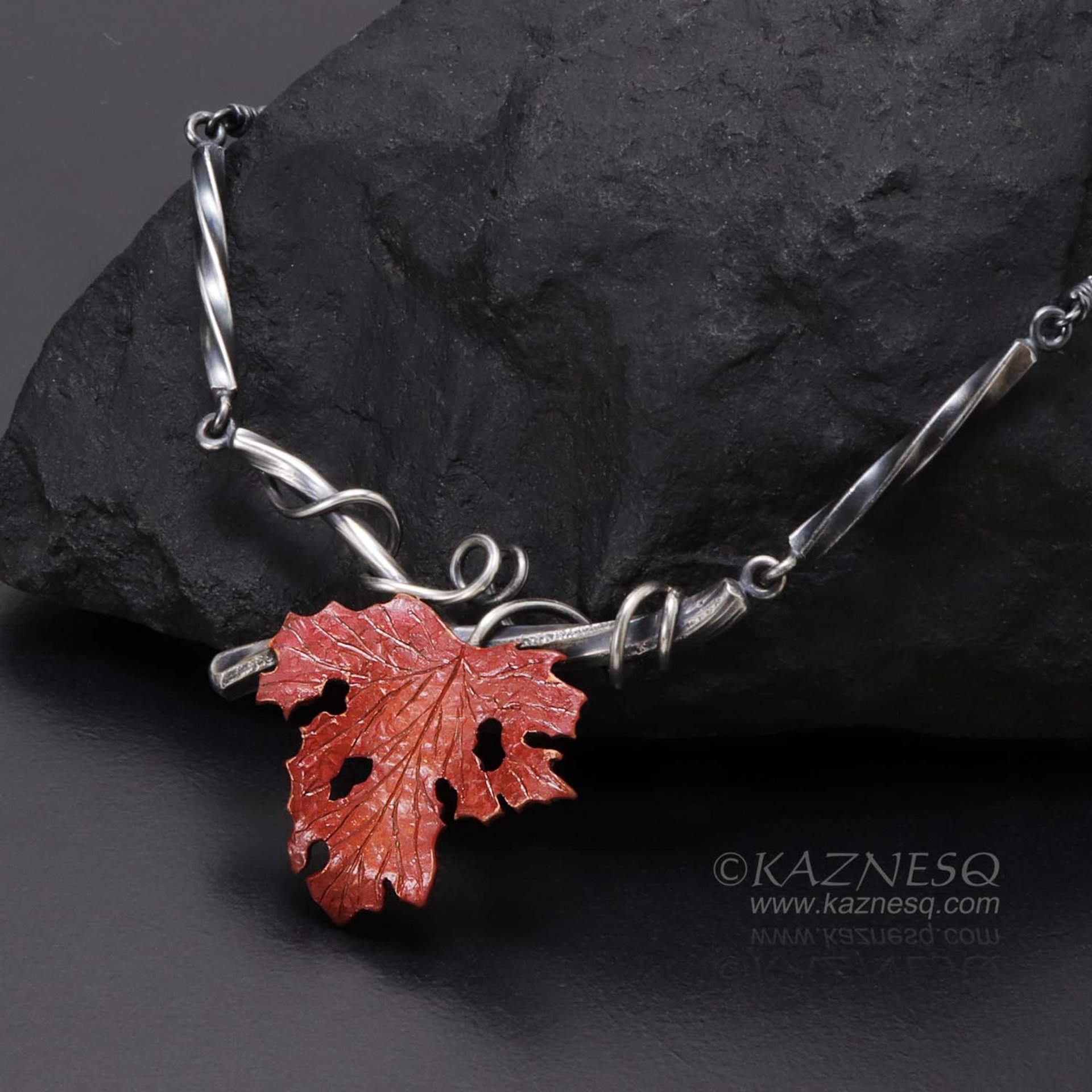 Withered copper grape leaf with Japanese patina and oxidized silver necklace .