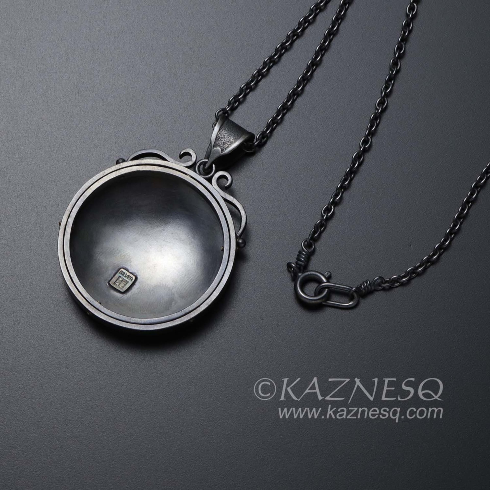 (C) KAZNESQ: Keum Boo oxidized silver round pendant of water pattern and fishes