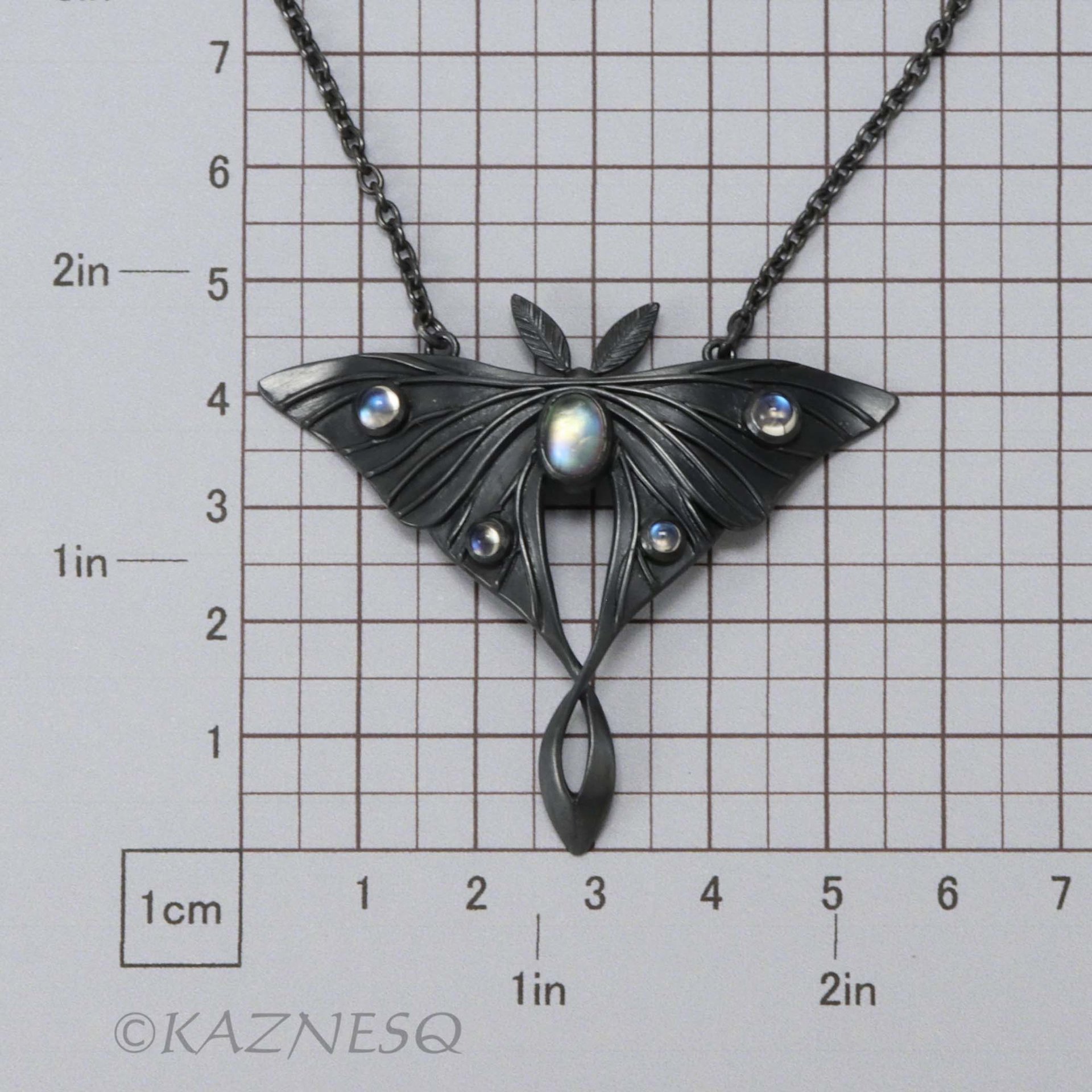 (C) KAZNESQ: Moon moth motif oxidized silver and Royal blue moonstone pendant