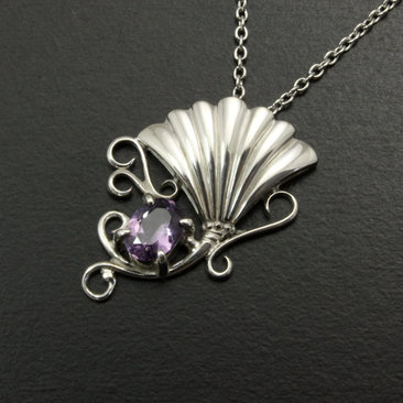 Purple spinel featured silver pendant of an imaginary flower