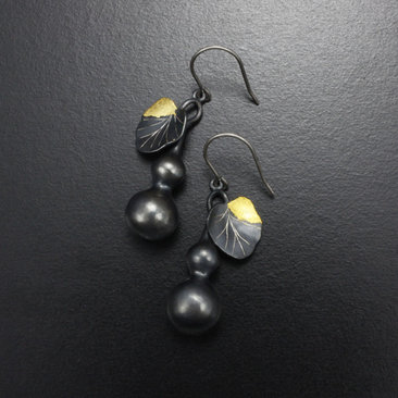 Gourd earrings of patinaed silver with fine gold leaf