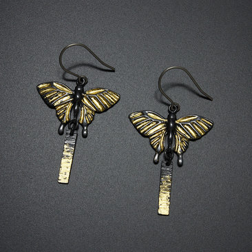 Oxidized silver butterfly earrings with fine gold leaf
